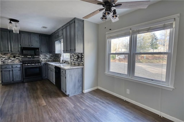 kitchen featuring sink, dark wood-type flooring, decorative backsplash, and black appliances