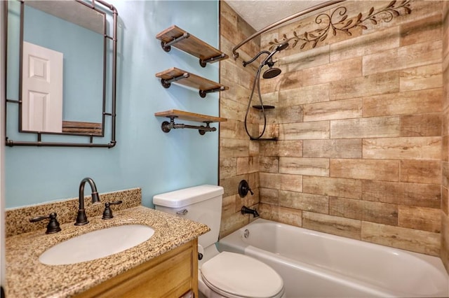 full bathroom with tiled shower / bath, vanity, and toilet