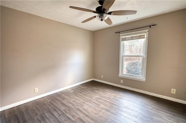 unfurnished room with ceiling fan and wood-type flooring