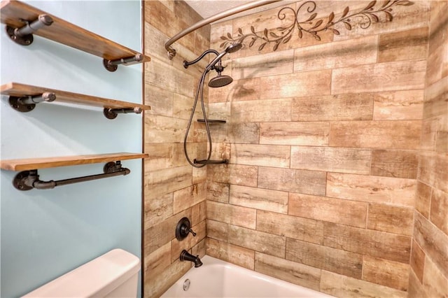 bathroom with toilet and tiled shower / bath combo