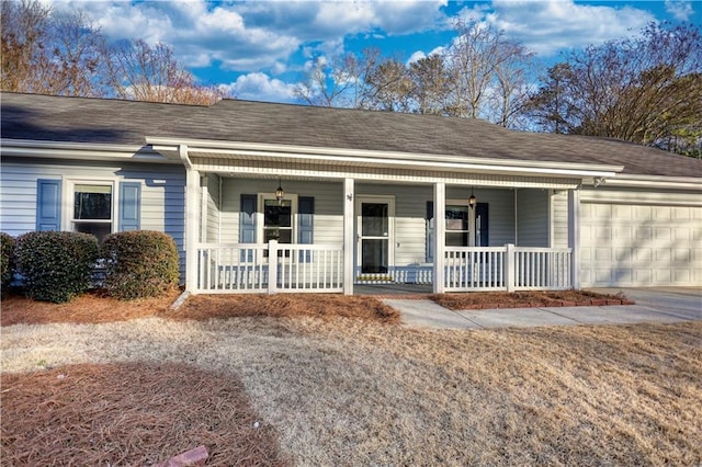 ranch-style house featuring a garage and a porch