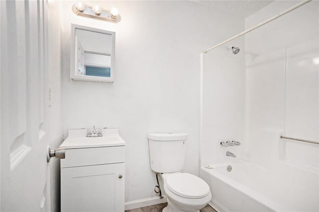 full bathroom with vanity,  shower combination, a textured ceiling, and toilet