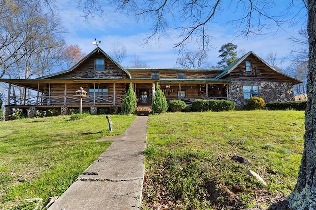 log cabin with a porch and a front yard