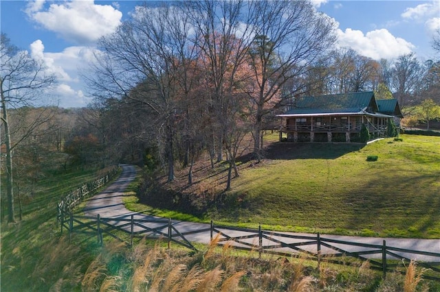 surrounding community featuring a yard and fence