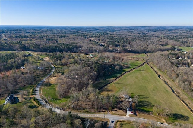 aerial view with a rural view and a view of trees