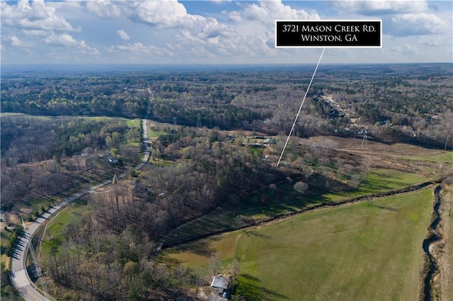 bird's eye view with a forest view and a rural view