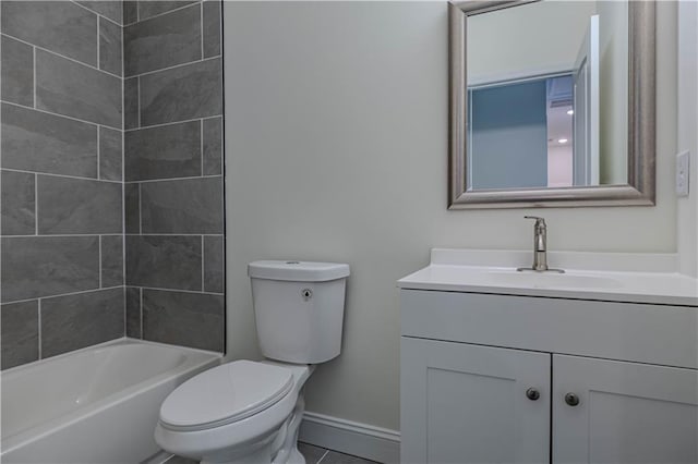 full bathroom featuring tiled shower / bath, tile patterned flooring, vanity, and toilet