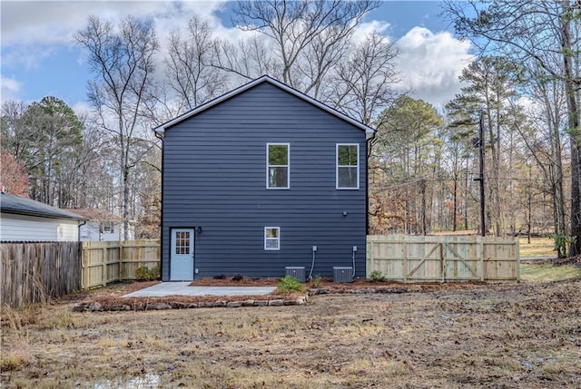 back of house featuring central AC unit