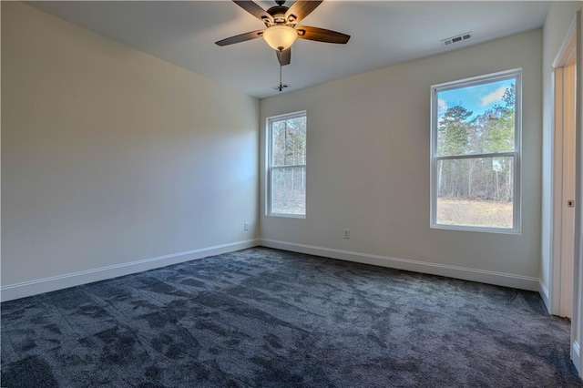 carpeted empty room featuring ceiling fan