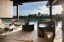 view of patio / terrace with ceiling fan and a fireplace