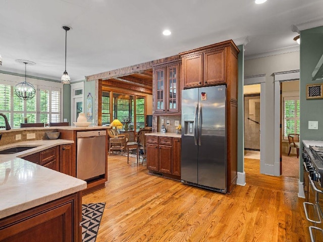 46 Bee Balm Way, Big Canoe, GA 30143 - kitchen with stainless steel appliances, ornamental molding, light countertops, light wood-type flooring, and glass insert cabinets