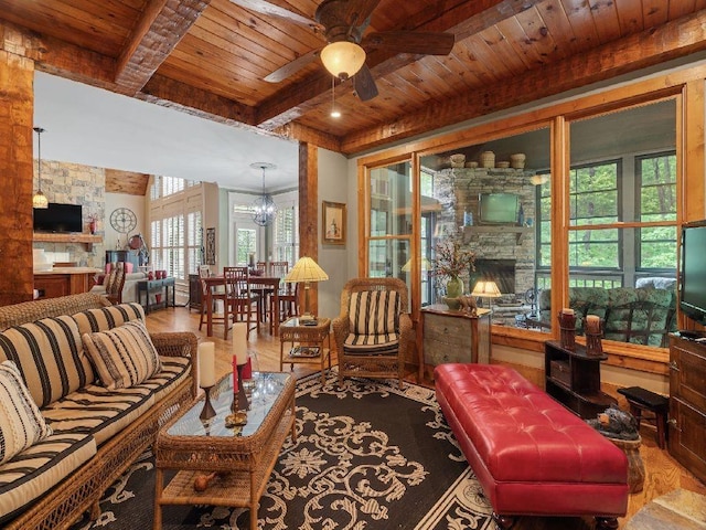 46 Bee Balm Way, Big Canoe, GA 30143 - living area with a fireplace, a wooden ceiling with exposed beams, ceiling fan, a chandelier, and wood finished floors