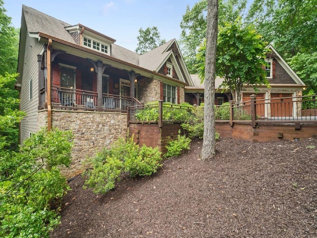 46 Bee Balm Way, Big Canoe, GA 30143 - view of front facade featuring covered porch and a shingled roof