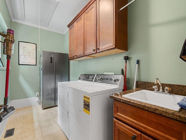 46 Bee Balm Way, Big Canoe, GA 30143 - laundry area featuring attic access, cabinet space, washer and clothes dryer, and light tile patterned floors
