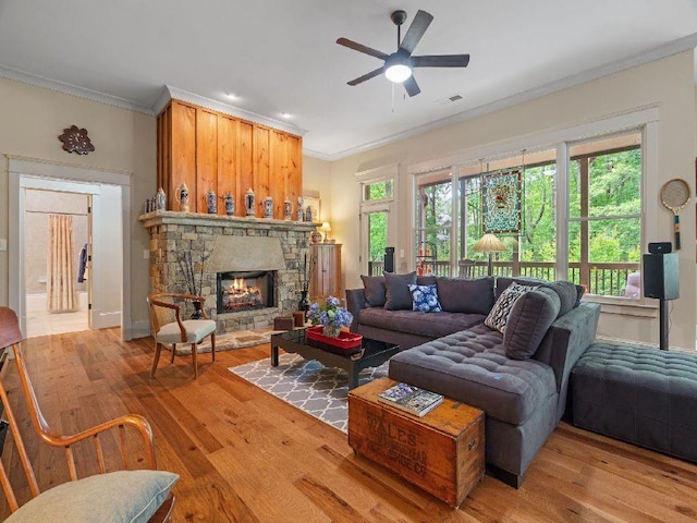 46 Bee Balm Way, Big Canoe, GA 30143 - living room with crown molding, wood finished floors, ceiling fan, and a stone fireplace