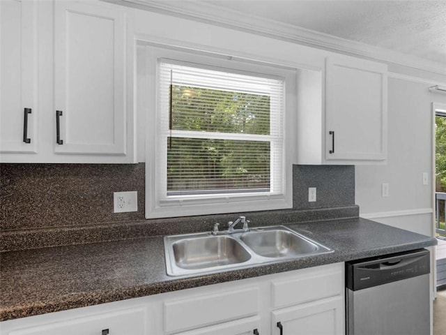 4720 Hull Rd, Conyers, GA 30094 - kitchen with stainless steel dishwasher, white cabinets, backsplash, and crown molding