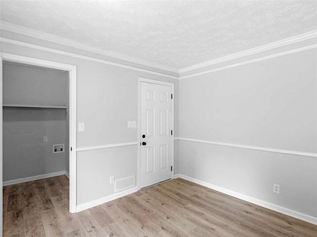 4720 Hull Rd, Conyers, GA 30094 - spare room featuring a textured ceiling, wood finished floors, and ornamental molding