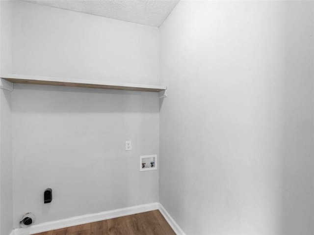4720 Hull Rd, Conyers, GA 30094 - laundry room with washer hookup, dark wood-type flooring, and a textured ceiling
