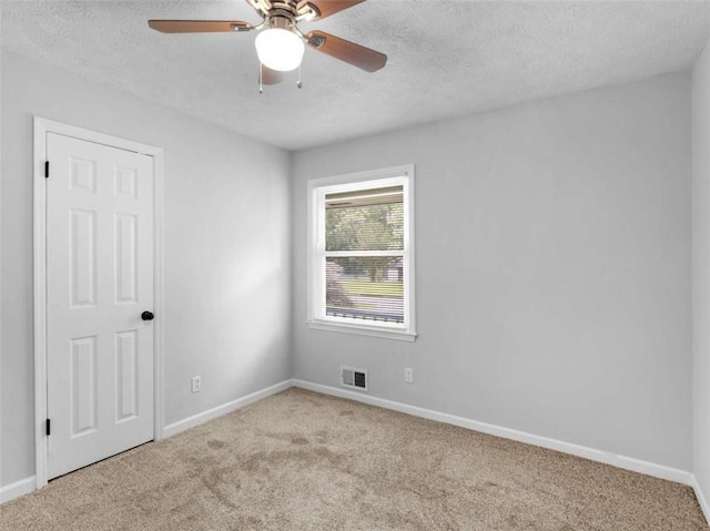 4720 Hull Rd, Conyers, GA 30094 - carpeted spare room with a textured ceiling and ceiling fan