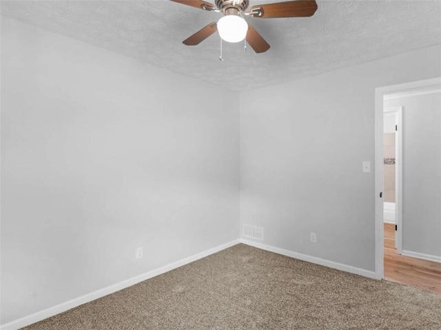 4720 Hull Rd, Conyers, GA 30094 - unfurnished room with a textured ceiling, carpet, and a ceiling fan
