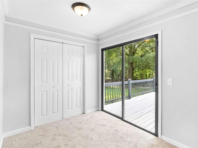 4720 Hull Rd, Conyers, GA 30094 - unfurnished bedroom featuring access to exterior, crown molding, carpet flooring, and a closet