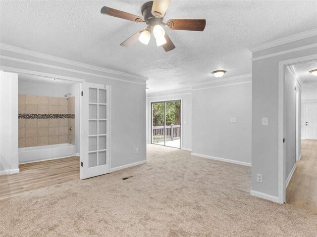 4720 Hull Rd, Conyers, GA 30094 - empty room featuring carpet, a ceiling fan, crown molding, and a textured ceiling