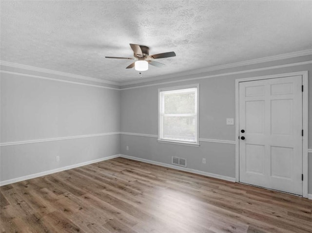4720 Hull Rd, Conyers, GA 30094 - unfurnished room with a ceiling fan, a textured ceiling, wood finished floors, and crown molding
