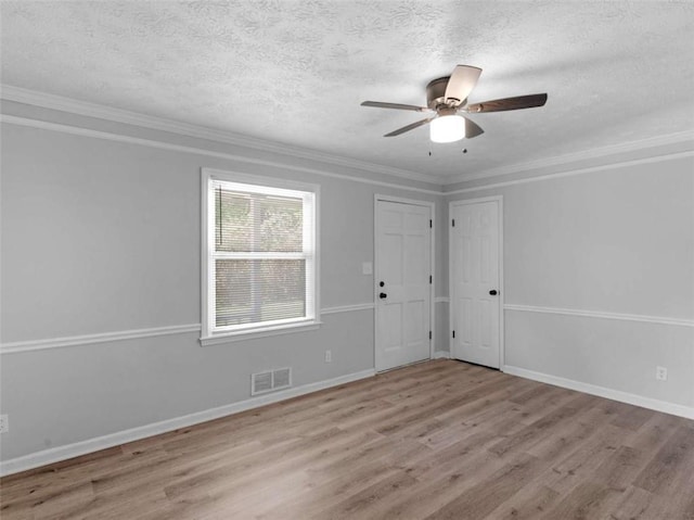 4720 Hull Rd, Conyers, GA 30094 - spare room featuring wood finished floors, a textured ceiling, a ceiling fan, and crown molding