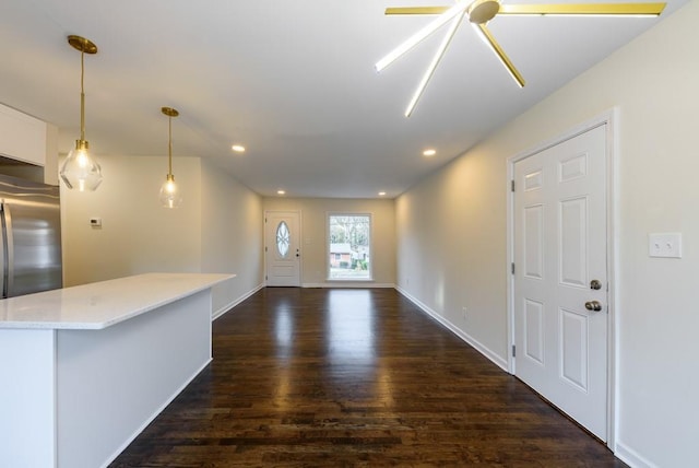 interior space with recessed lighting, baseboards, and dark wood-style flooring