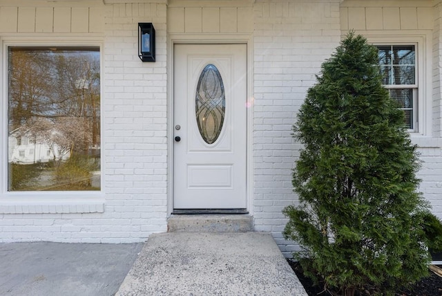 property entrance with brick siding