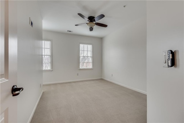 carpeted empty room with ceiling fan