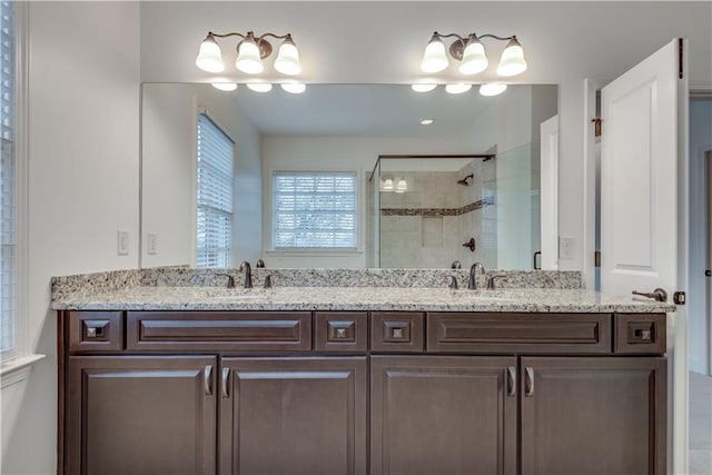 bathroom with vanity and walk in shower