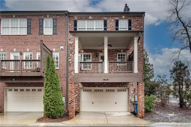 view of property with ceiling fan, a balcony, and a garage