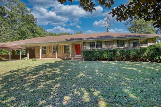 ranch-style house featuring a carport and a front yard