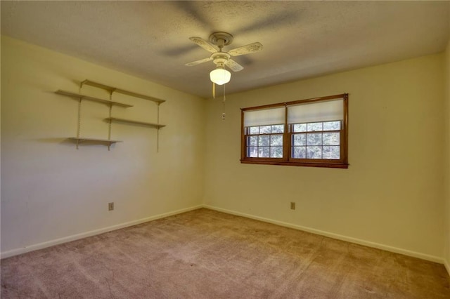 empty room with light carpet and ceiling fan