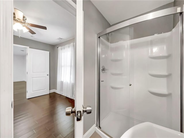 644 Albert St NW, Atlanta, GA 30318 - bathroom with a shower stall, a ceiling fan, and wood finished floors