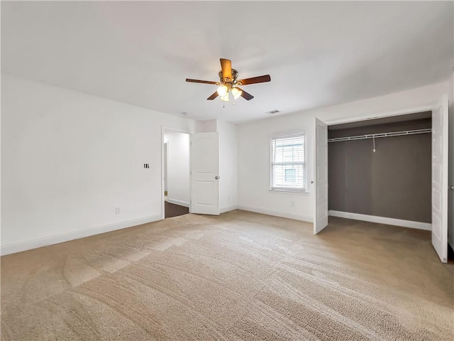 644 Albert St NW, Atlanta, GA 30318 - unfurnished bedroom featuring carpet flooring, a closet, and a ceiling fan