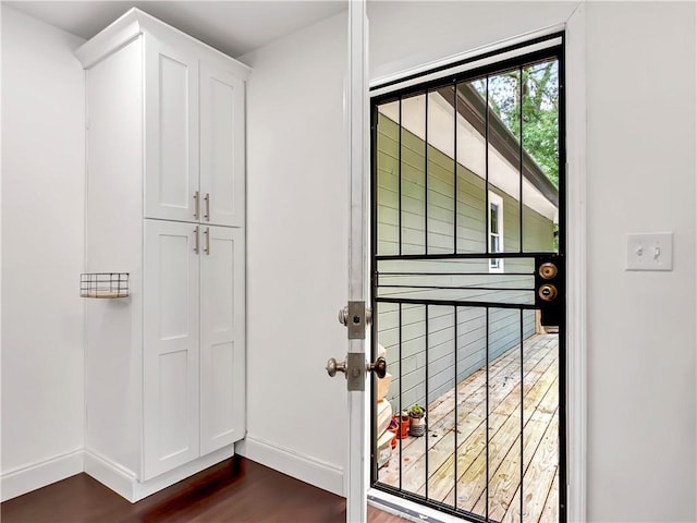 644 Albert St NW, Atlanta, GA 30318 - entryway with dark wood-type flooring and baseboards