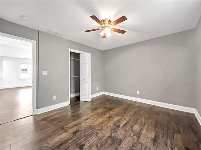 644 Albert St NW, Atlanta, GA 30318 - unfurnished bedroom with dark wood-style flooring, a closet, and ceiling fan