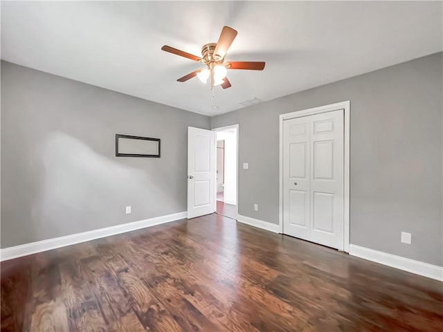 644 Albert St NW, Atlanta, GA 30318 - unfurnished bedroom with wood finished floors, a closet, and a ceiling fan