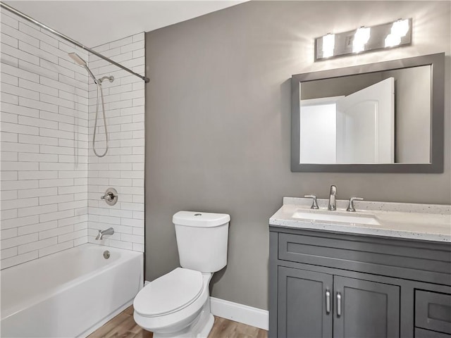 644 Albert St NW, Atlanta, GA 30318 - bathroom with vanity, wood finished floors, and shower / washtub combination