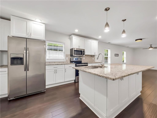 644 Albert St NW, Atlanta, GA 30318 - kitchen featuring stainless steel appliances, dark wood-style floors, healthy amount of natural light, white cabinetry, and recessed lighting