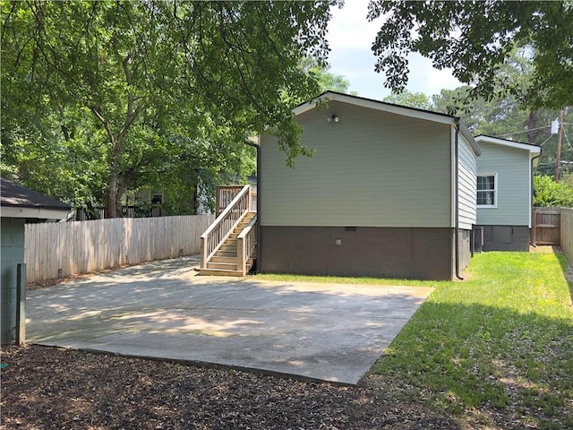 644 Albert St NW, Atlanta, GA 30318 - back of property featuring crawl space, a patio area, a fenced backyard, and stairs