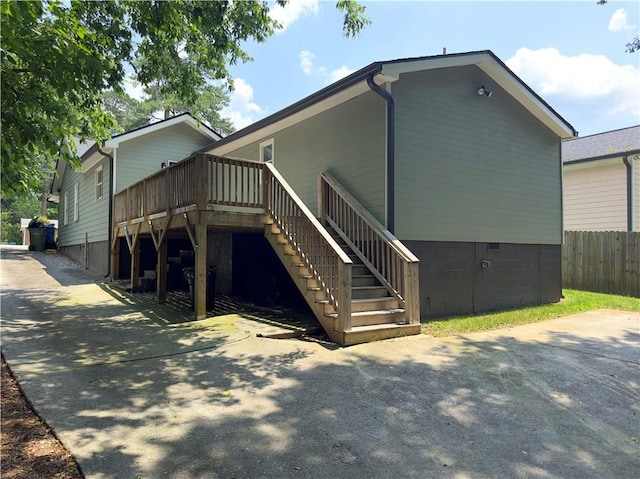 644 Albert St NW, Atlanta, GA 30318 - rear view of house featuring stairway, a deck, and crawl space