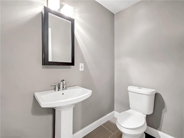 644 Albert St NW, Atlanta, GA 30318 - half bath with baseboards and tile patterned flooring