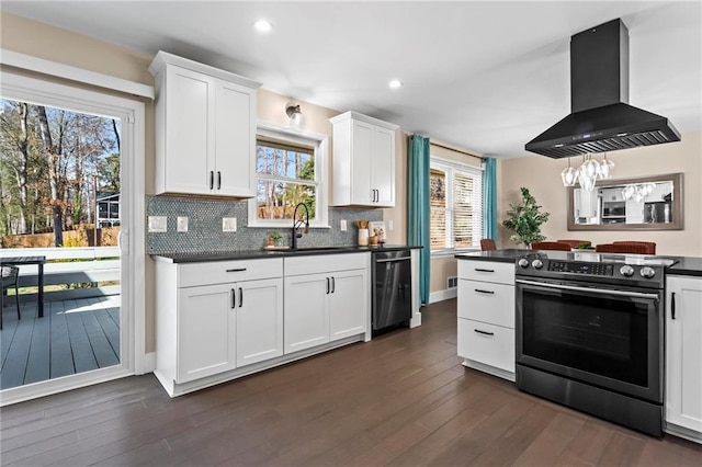 kitchen with dark countertops, dishwasher, exhaust hood, electric range, and a sink