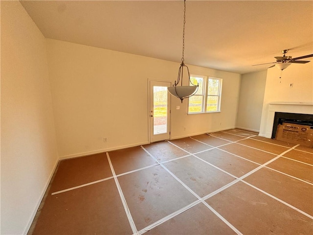 unfurnished dining area with ceiling fan