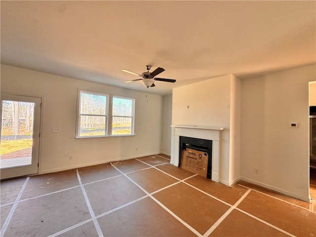 unfurnished living room with ceiling fan