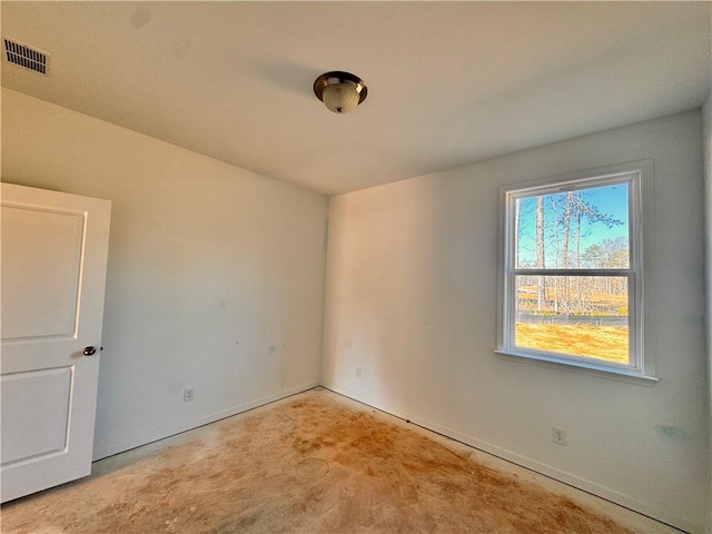 unfurnished room featuring concrete floors