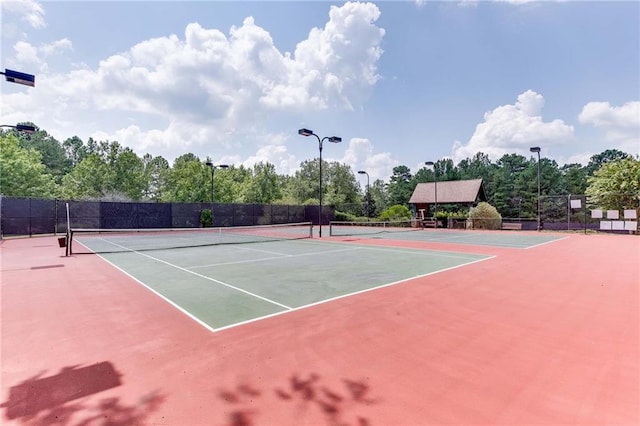 view of sport court featuring basketball hoop